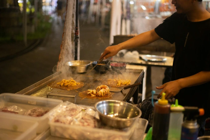 street food chef preparing nasi bakar in Jakarta
